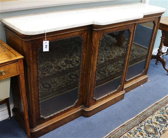 A Victorian marble top walnut breakfront cabinet W.169cm